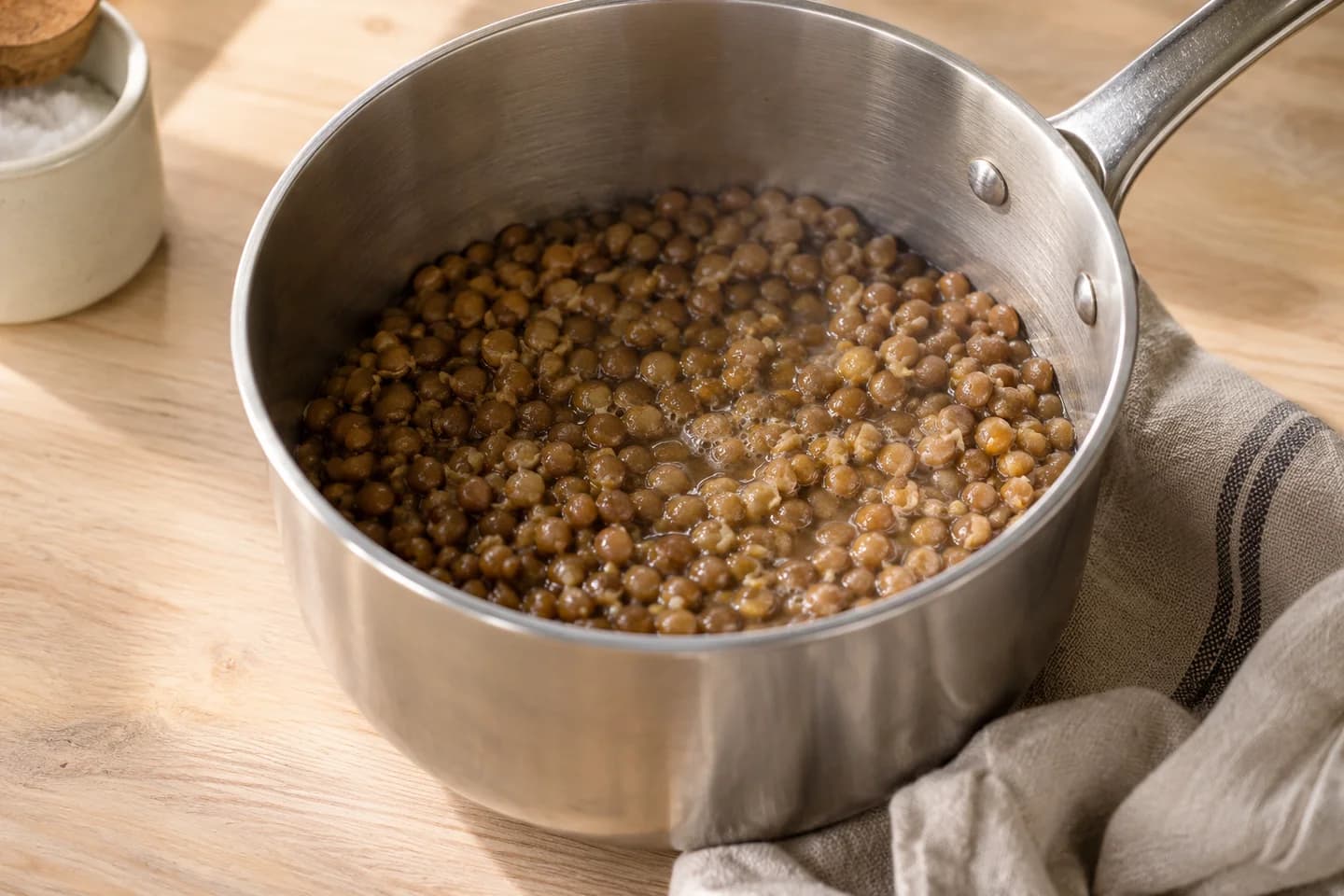 Harissa Carrot Lentil Bowls: Warm lentils in a saucepan with 60 ml water and remaining salt for 4 minutes